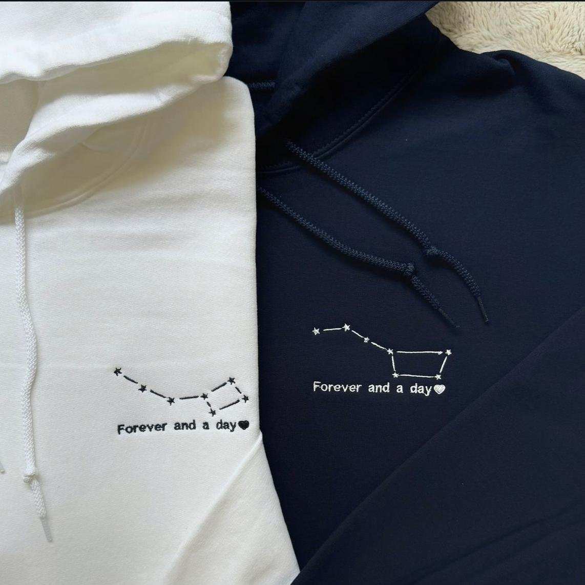 Matching couple hoodies with embroidered constellation design and the phrase “Forever and a day” on the front.