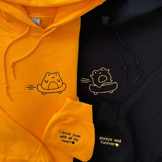 Matching couple hoodies with embroidered bear characters and sleeve messages – “I love you with all my heart” and “always and forever.”
