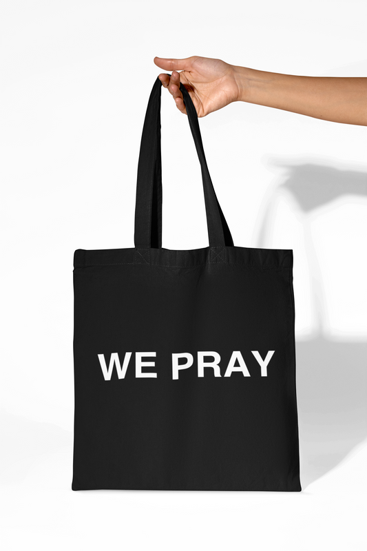 We Pray Tote bag